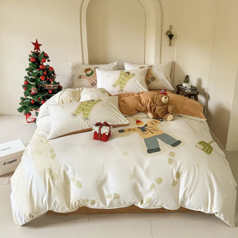 Christmas cartoon printed duvet cover and pillowcases on a bed, showing Gingerbread Man pattern.