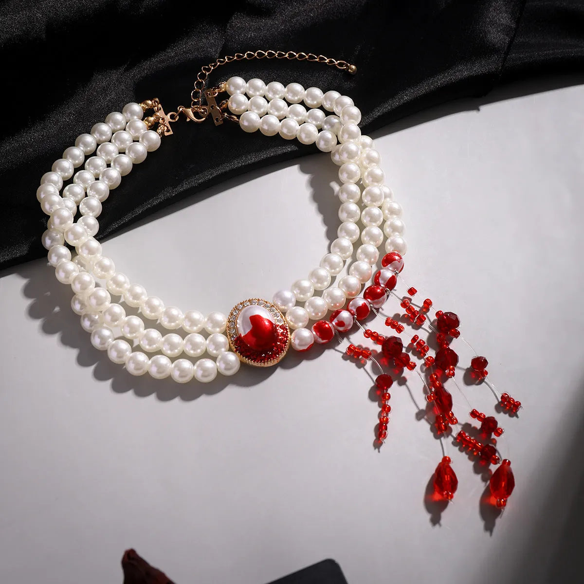 Gothic pearl collar jewellery set with gold electroplated finishes showing necklace, bracelet, and earrings