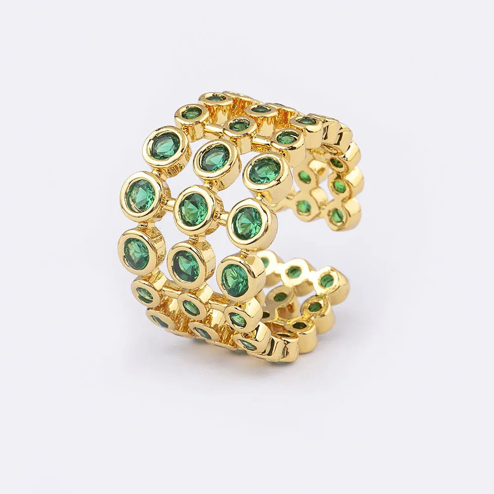 Copper ring with gold plating and green zircon stones on wide band