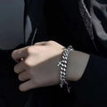 Men's titanium steel bracelet with geometric cross design showing cold wind styling