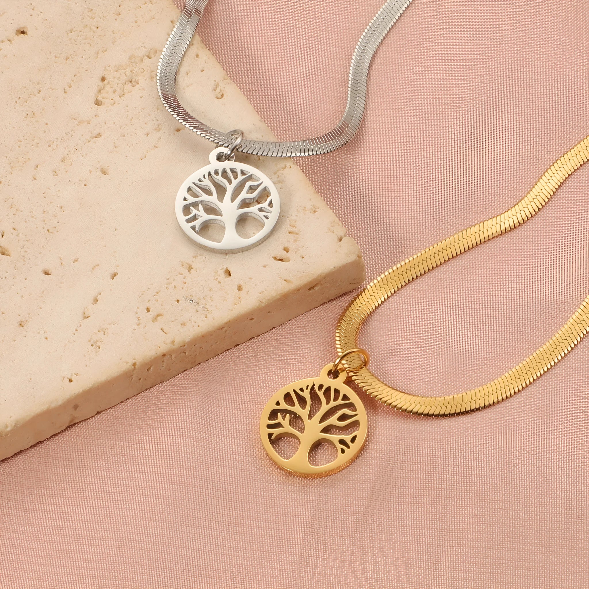 Stainless steel necklace with a U-shaped tree pendant on an adjustable snake chain.