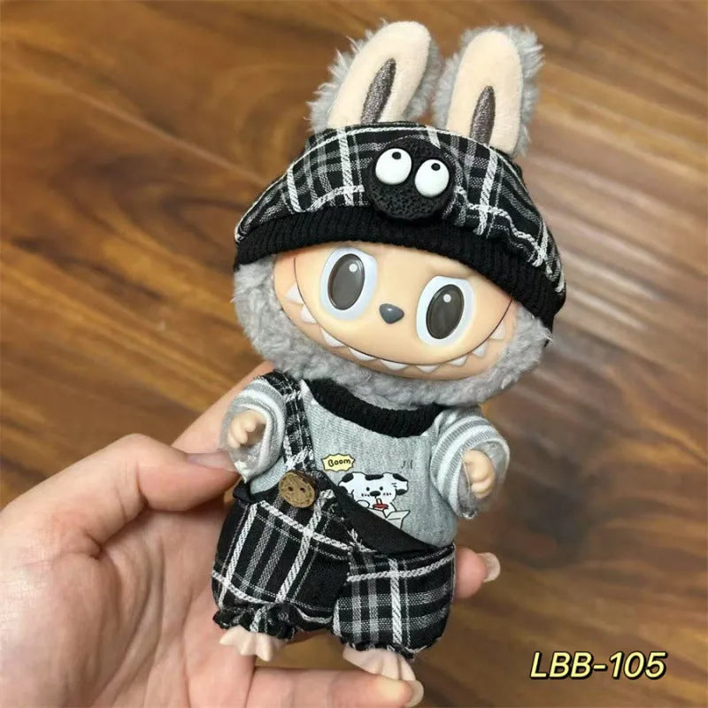 Plastic doll clothes for a 17cm tall vinyl figure on a white background.