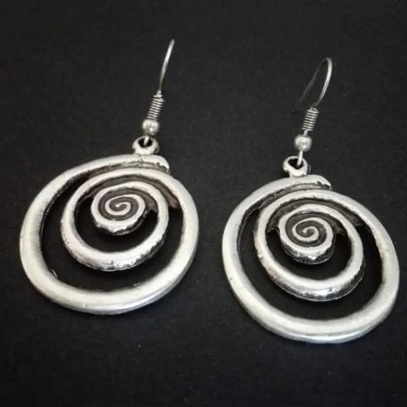 Retro geometric spiral earrings with distressed silver finish measuring 2.6cm by 5cm