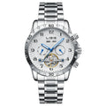 Men's silver automatic perpetual calendar mechanical watch with stainless steel strap on a wrist.
