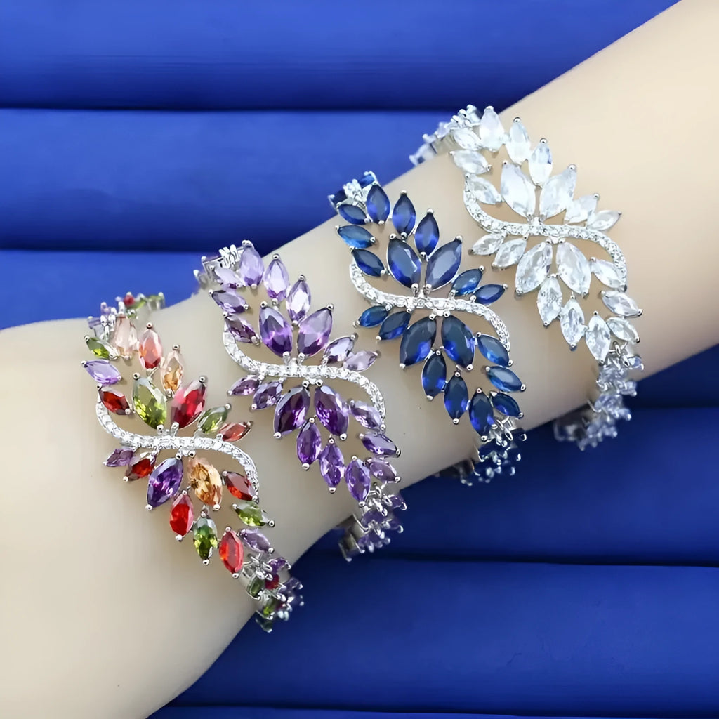 Gold electroplated copper bracelet with coloured zircon stones and ice flower detail.