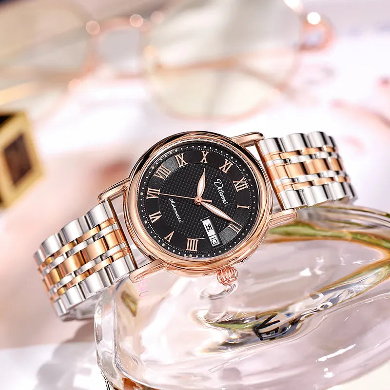 Women's automatic mechanical watch with white dial on a rose gold steel bracelet.
