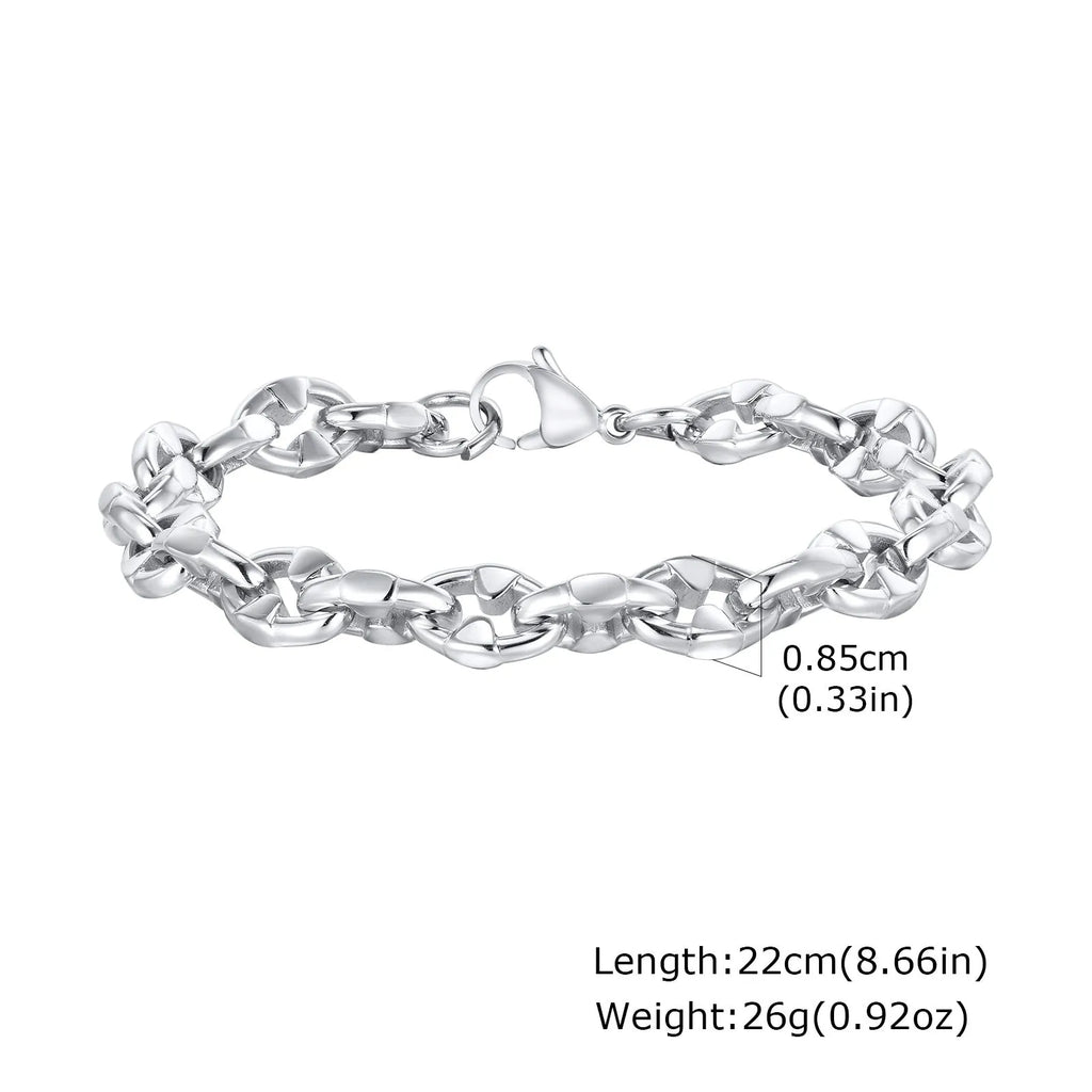 Close-up of a thick stainless steel geometric chain bracelet for men on a wrist.