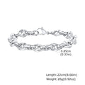 Men's thick stainless steel geometric chain bracelet in steel colour on a dark background.