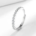 Women's open mouth geometric ring with a diamond tail, in white gold colour on a model's hand.