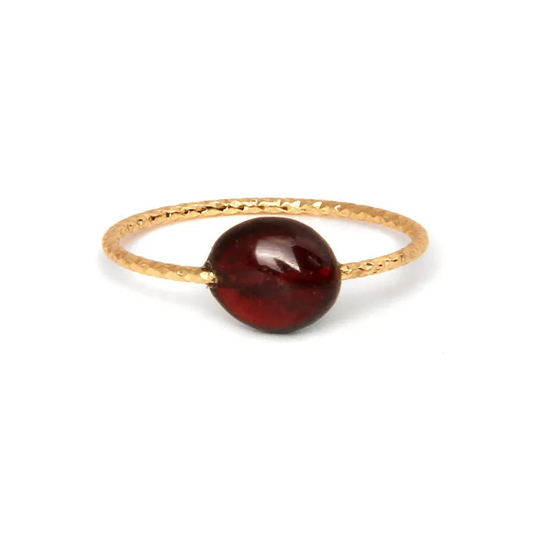 Women's geometric niche design ring with a coloured agate stone centrepiece.