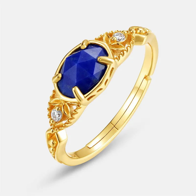 Elliptical silver alloy ring with a natural blue lapis lazuli gemstone for women.