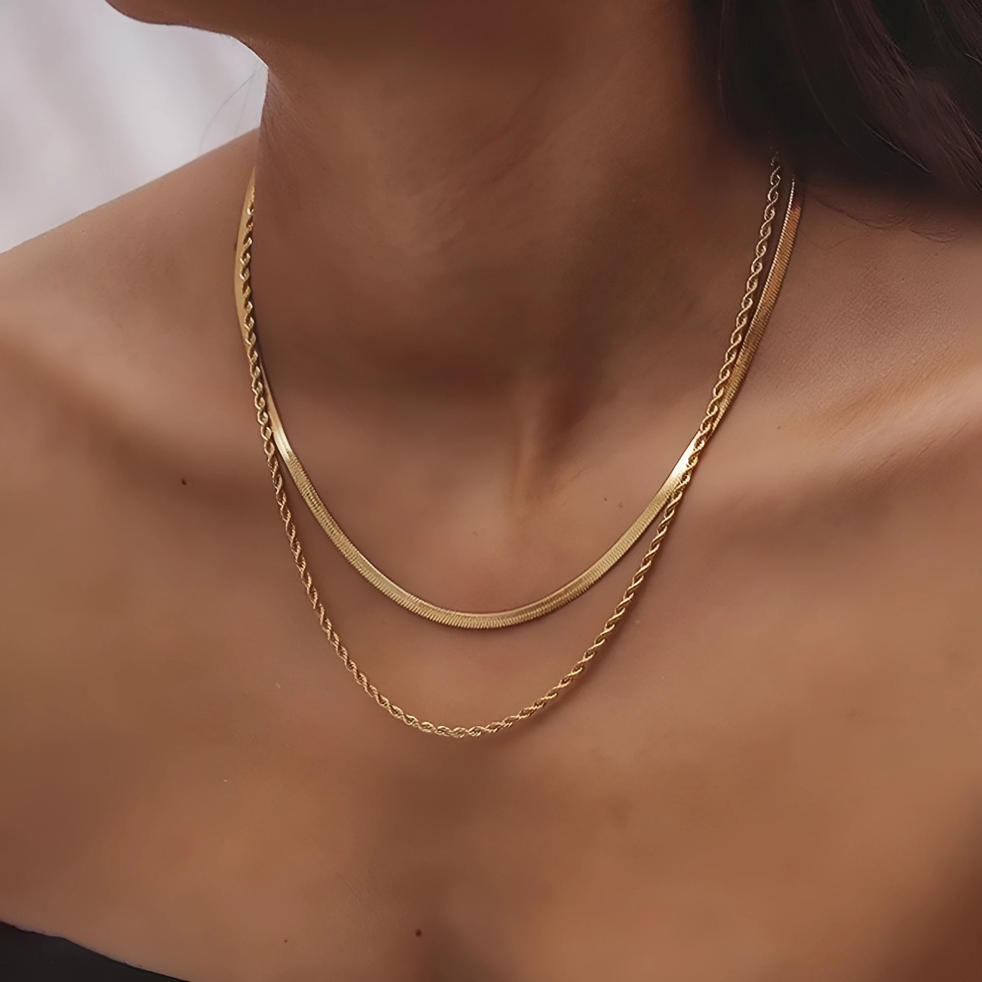 Gold geometric double-layer twist necklace on adjustable snake chain, shown at 40cm length.