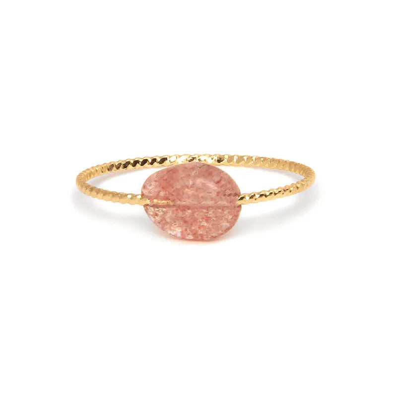 Women's geometric niche design ring with a coloured agate stone centrepiece.