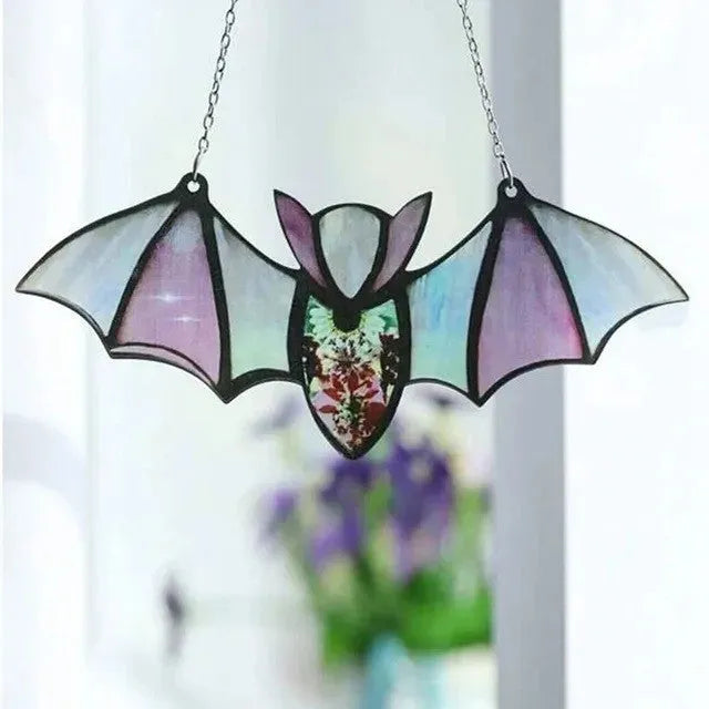 A modern art style bat printed on a clear acrylic wall hanging pendant.