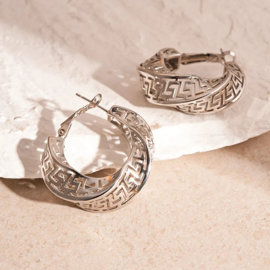 Geometric twisted round hollow stud earrings in gold or silver tone finish