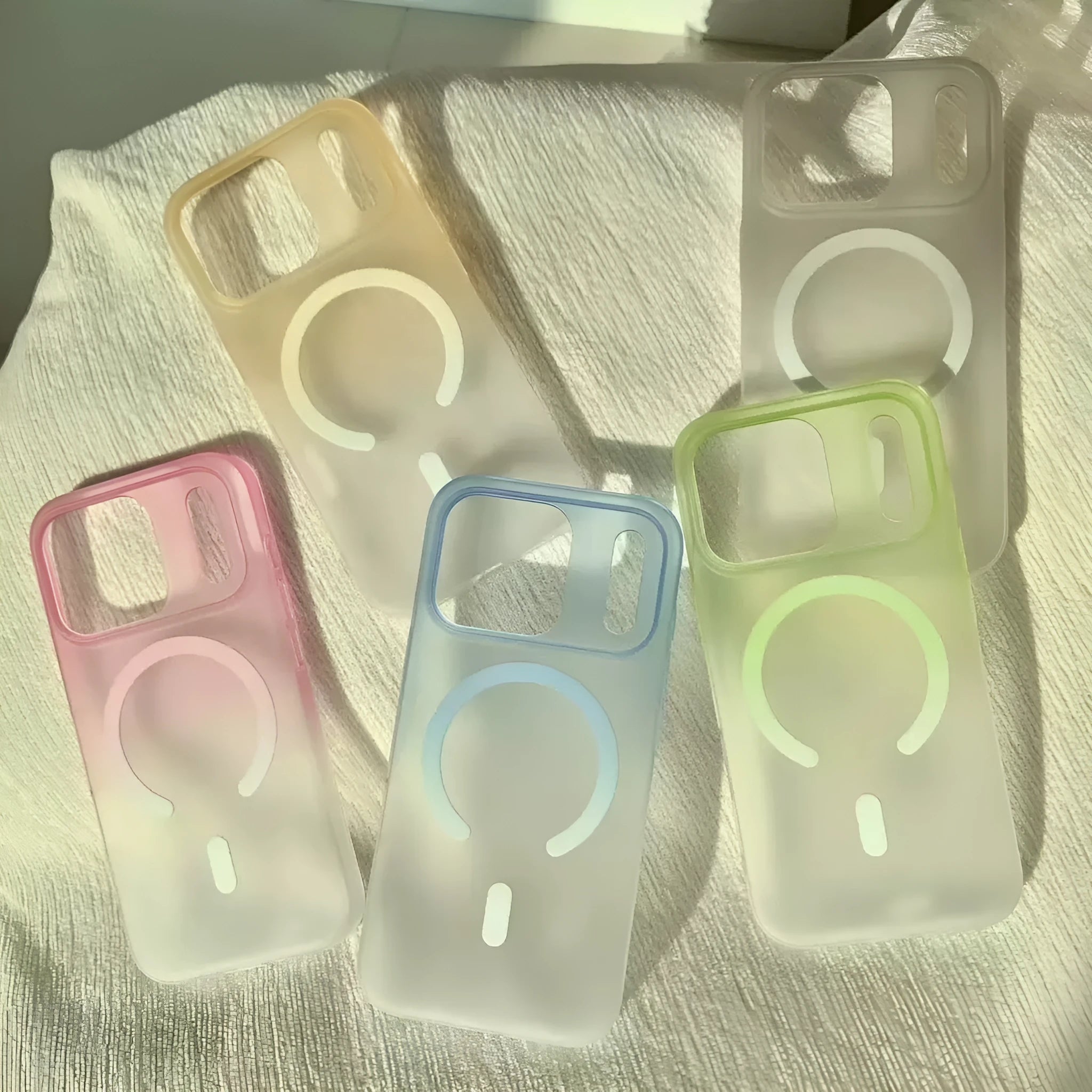 Gradient colour frosted magnetic suction protective case for iPhone on a white background.