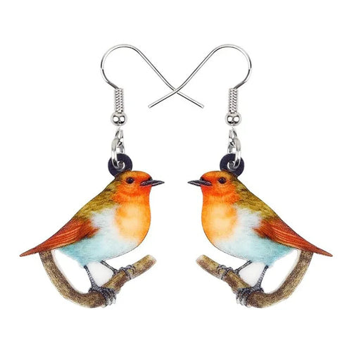Blue, yellow, and white titmouse bird acrylic pendant drop earrings on a white background.