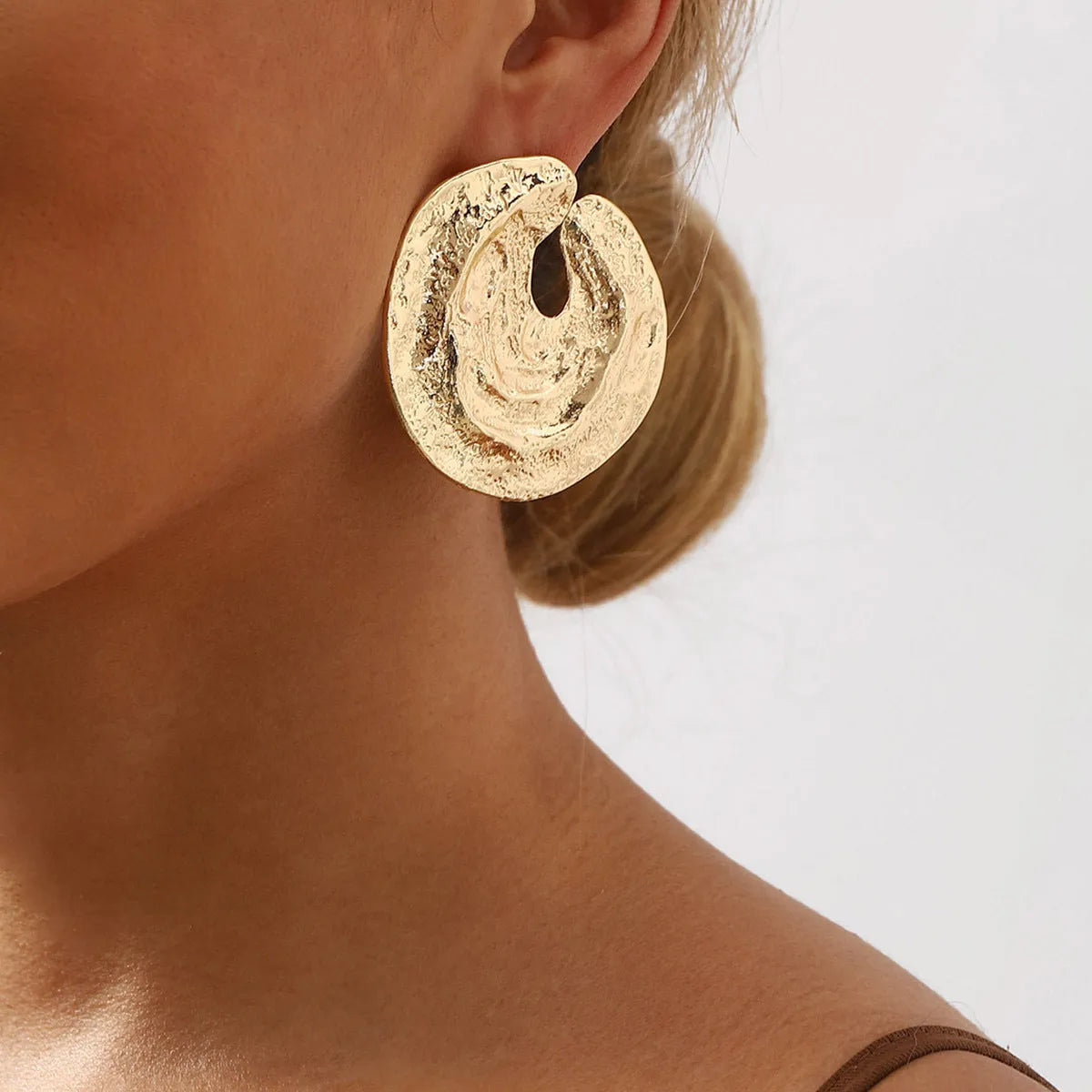 Exaggerated geometric women's earrings with irregular pleats and textured concave-convex surface