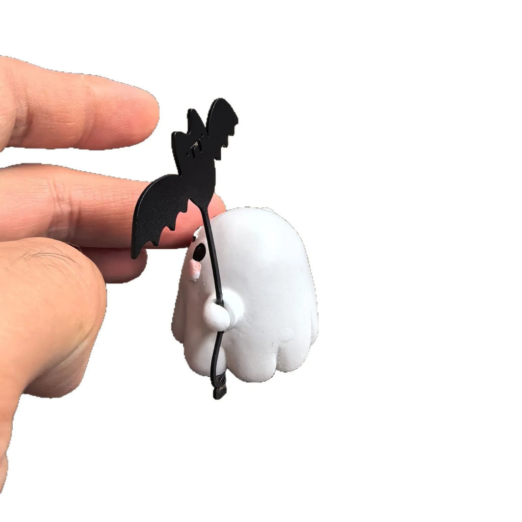 Mini resin Halloween statue of a cartoon ghost walking a bat, 4cm tall