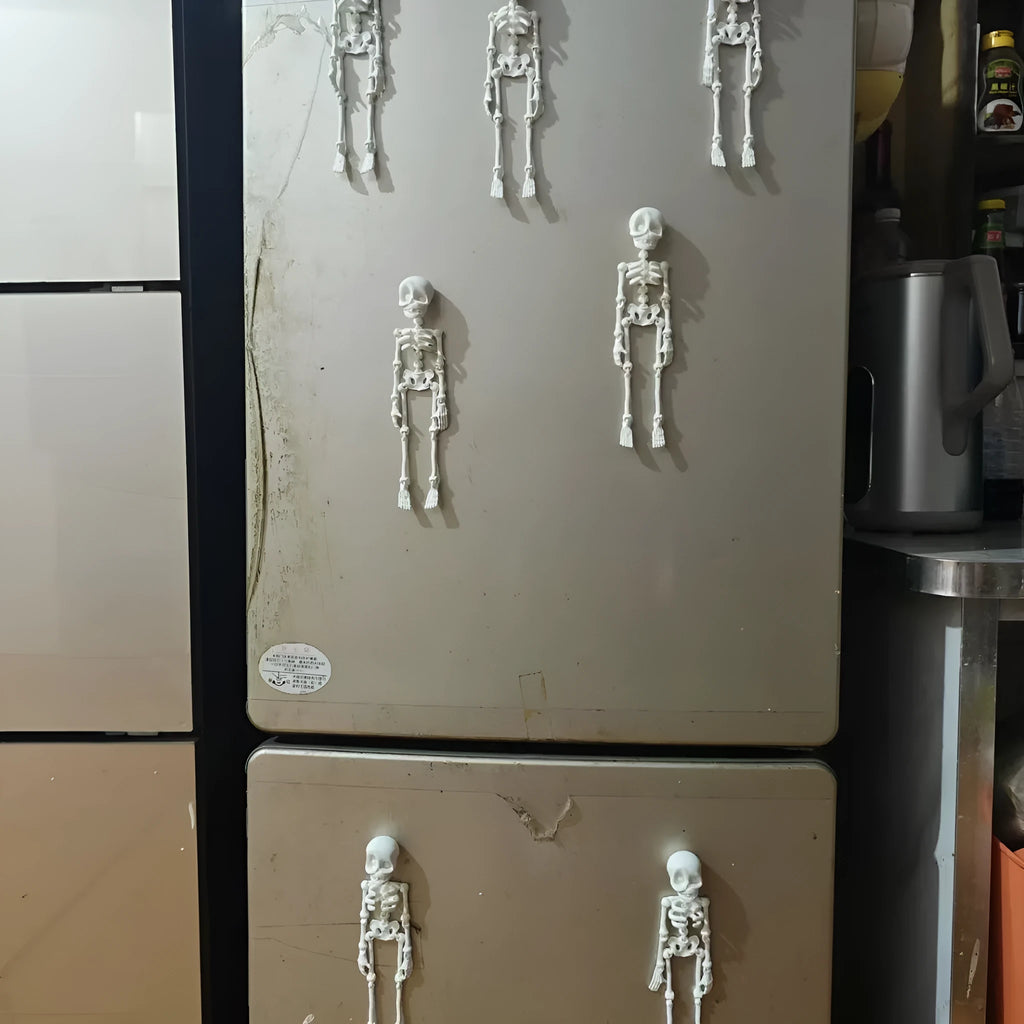 A tall 3D printed white skull refrigerator magnet for Halloween decoration.