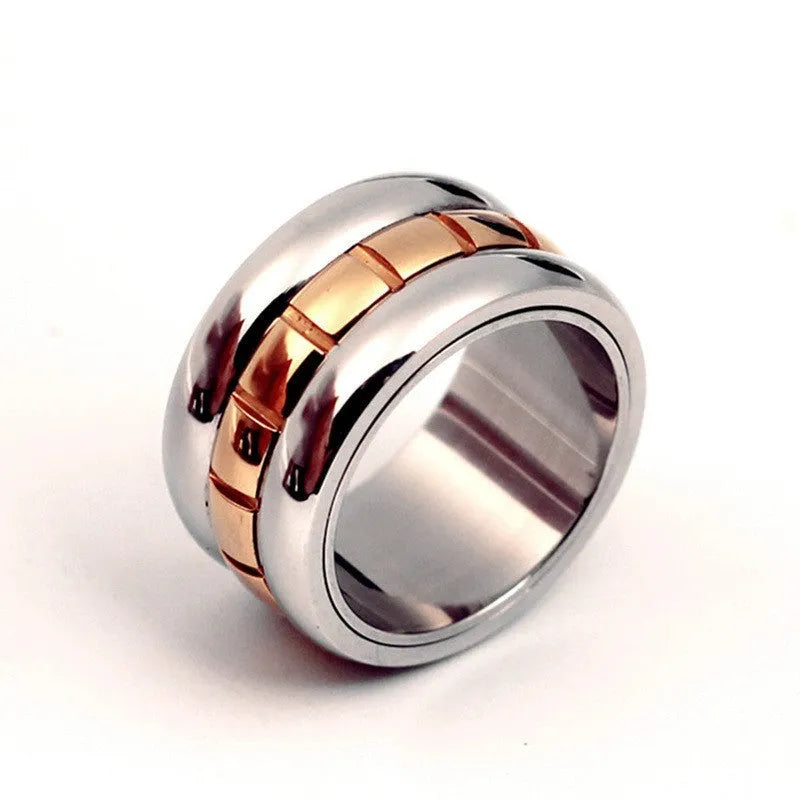 Gold titanium steel ultra-wide knuckle ring with a rotatable tail, shown on a finger.