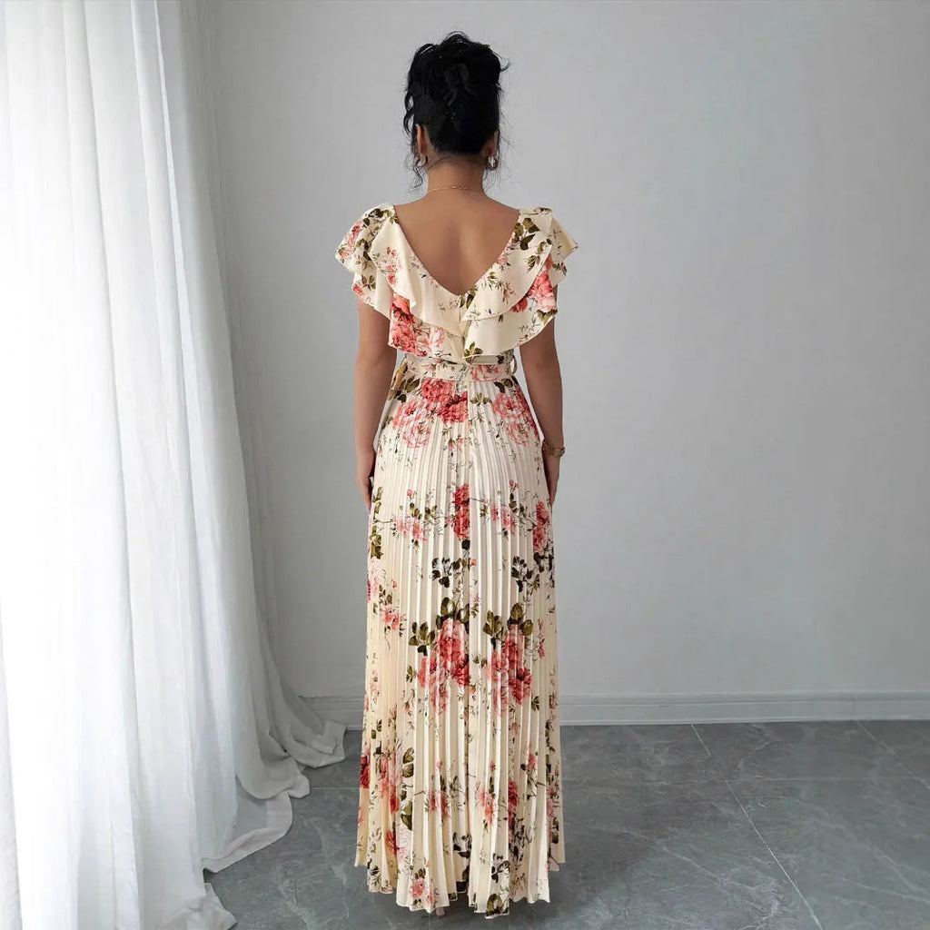 Apricot coloured V-neck floral print dress with ruffled sleeves and an oversized swing skirt