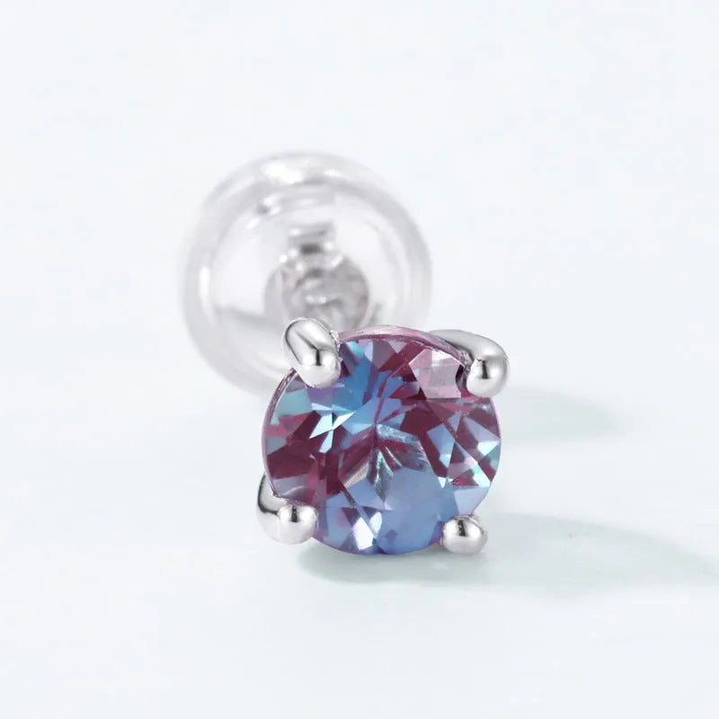 Simple geometric Alexander Stone ear studs in 925 silver with round design.