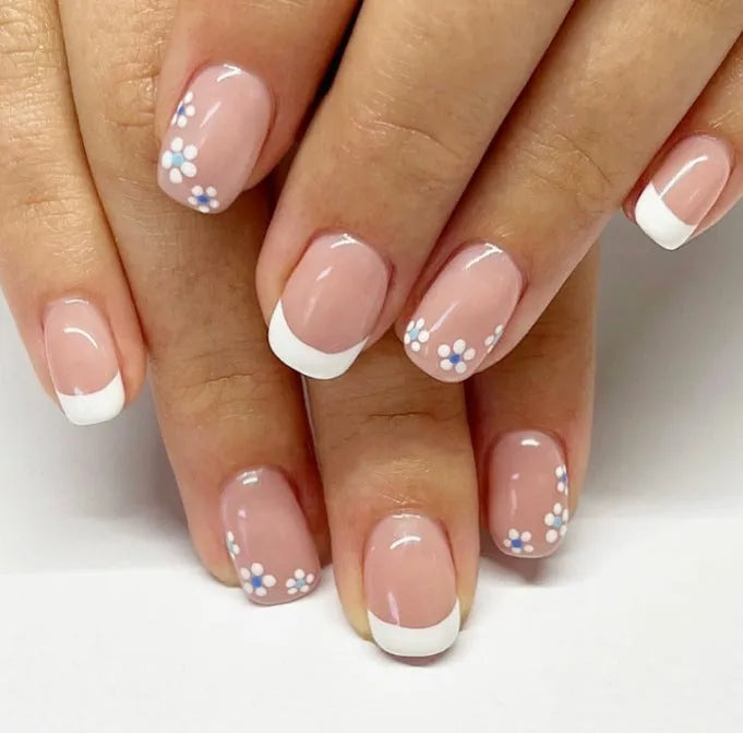 24 pieces of short wearable nail patches with white French flower pattern on plastic backing, with jelly glue wipe