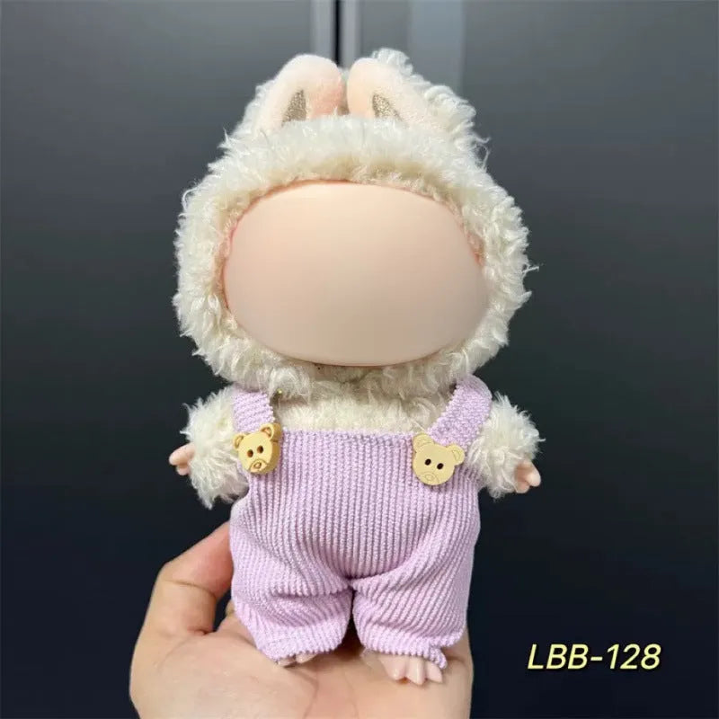 Plastic doll clothes for a 17cm tall vinyl figure on a white background.