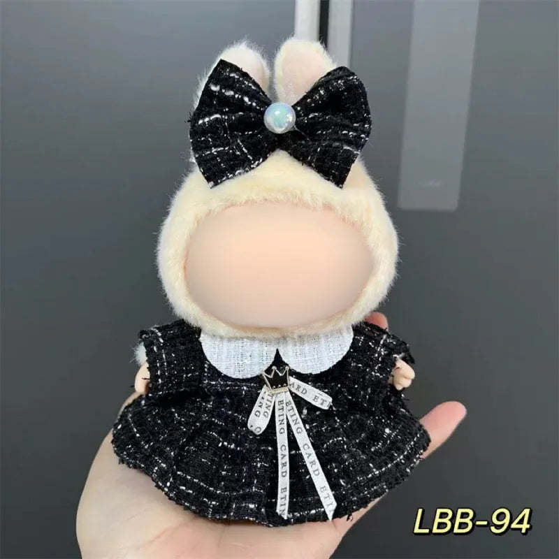 Plastic doll clothes for a 17cm tall vinyl figure on a white background.