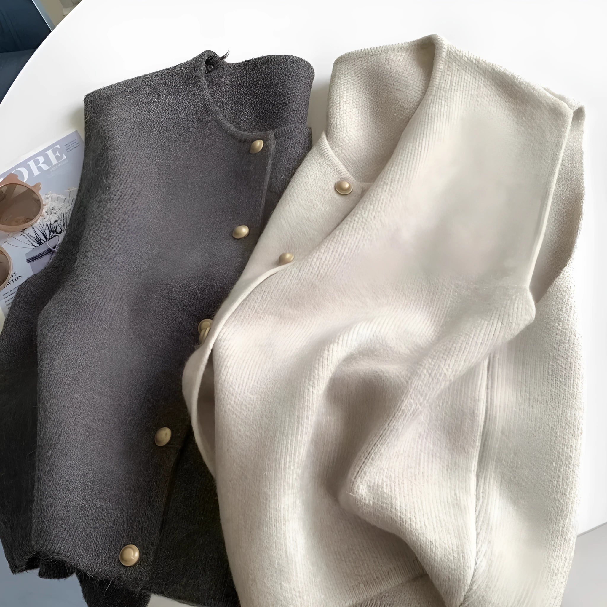 Women's thin grey polyester pullover vest with half sleeves, shown as a casual layering piece.