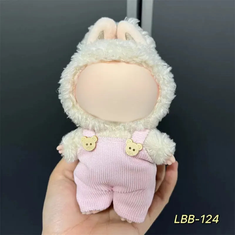 Plastic doll clothes for a 17cm tall vinyl figure on a white background.
