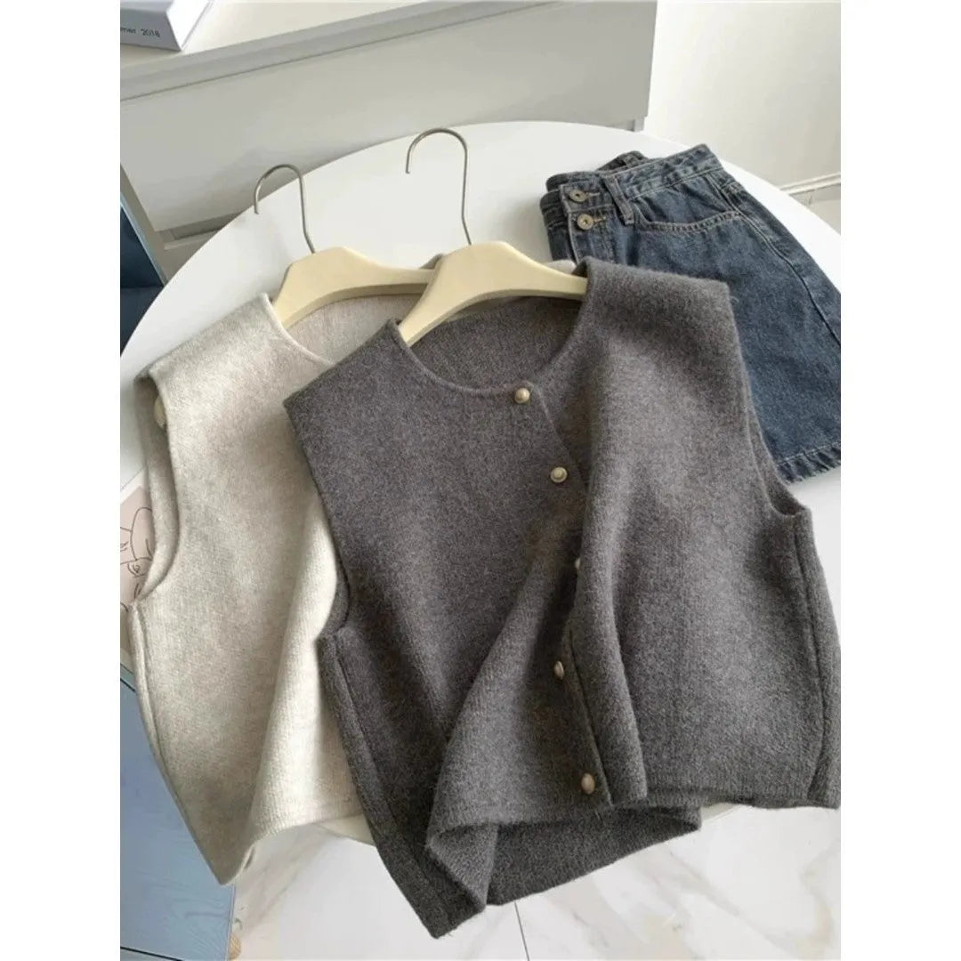 Women's thin grey polyester pullover vest with half sleeves, shown as a casual layering piece.
