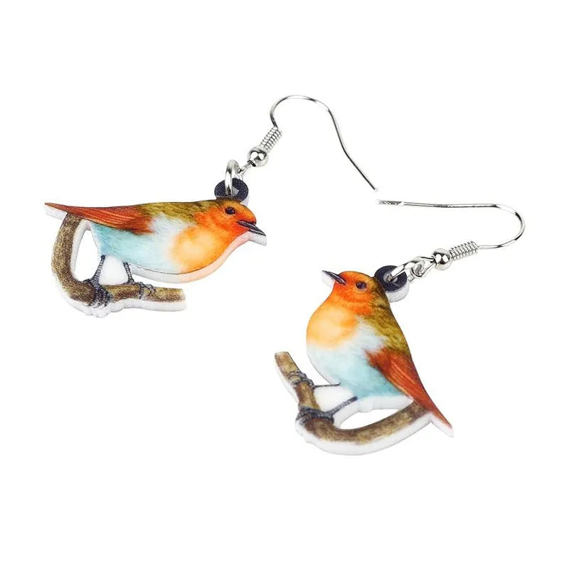 Blue, yellow, and white titmouse bird acrylic pendant drop earrings on a white background.