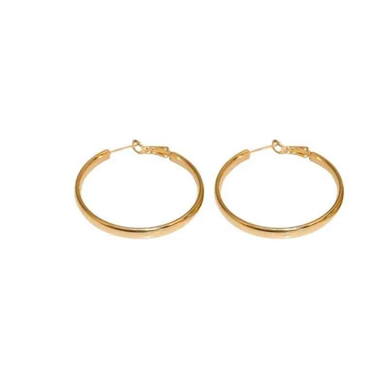 A pair of large gold-coloured metal circle earrings measuring 40mm in diameter