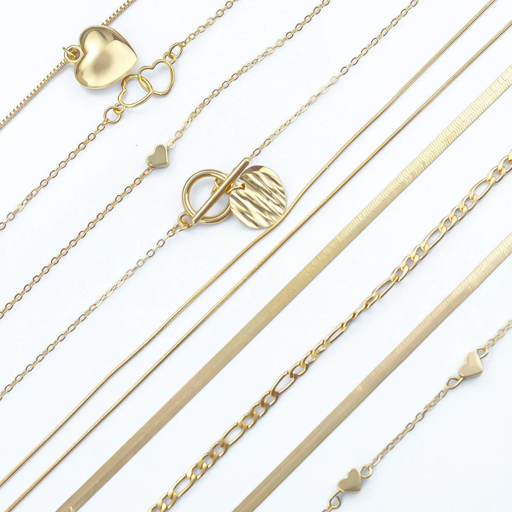 Ten gold electroplated women's necklaces with alloy pendants on snake bones chains