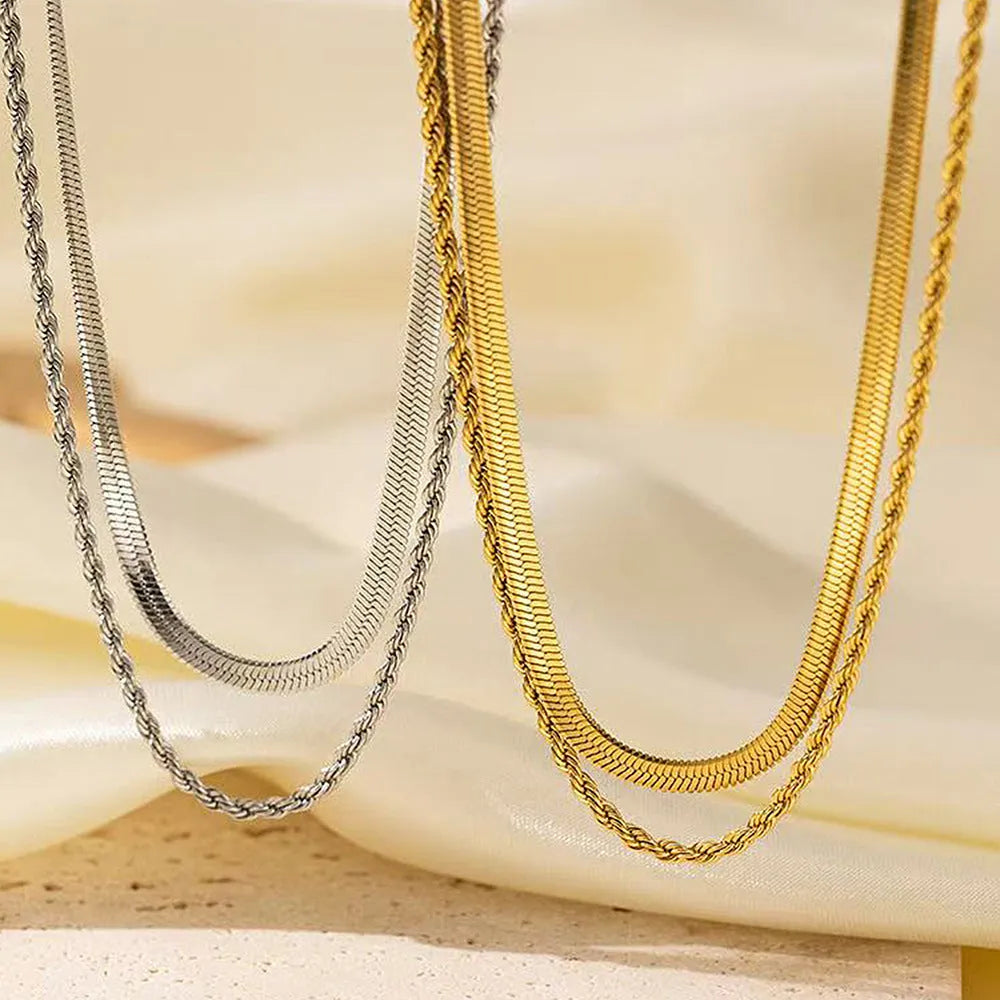 Gold geometric double-layer twist necklace on adjustable snake chain, shown at 40cm length.