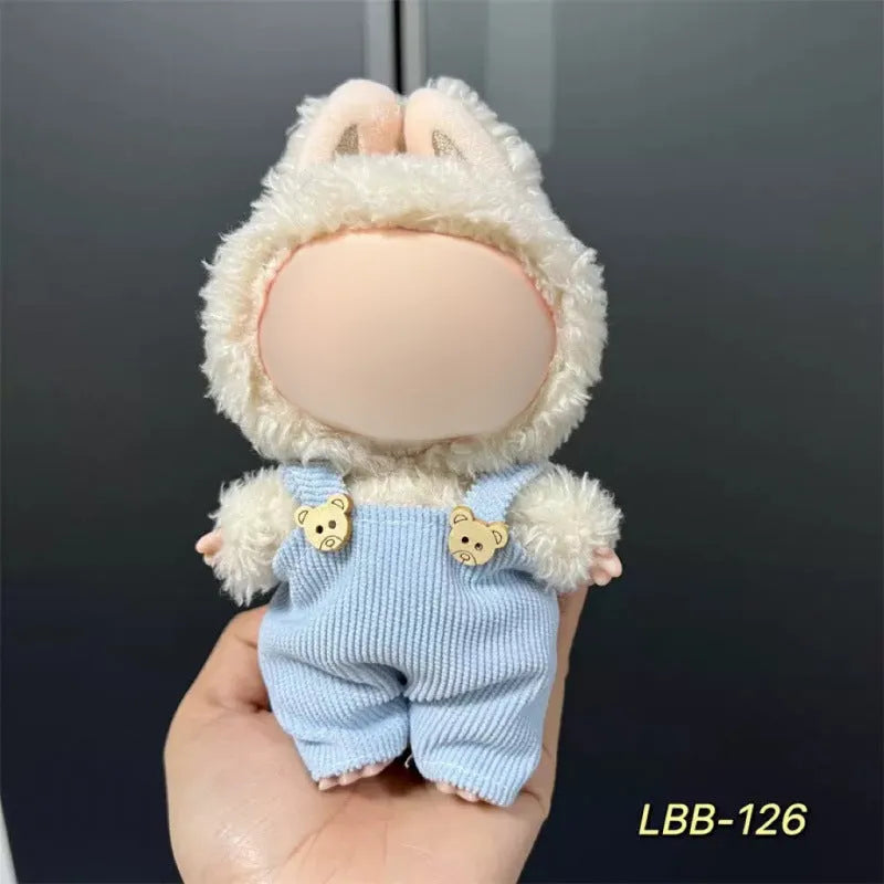 Plastic doll clothes for a 17cm tall vinyl figure on a white background.