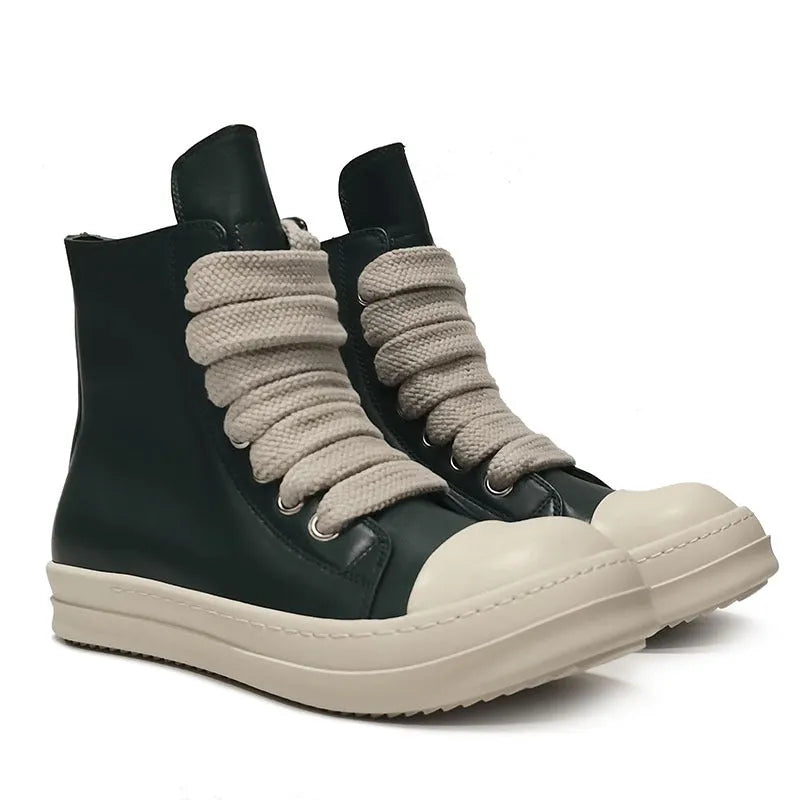 Black high-top genuine leather boots with side zip detail on a white background.