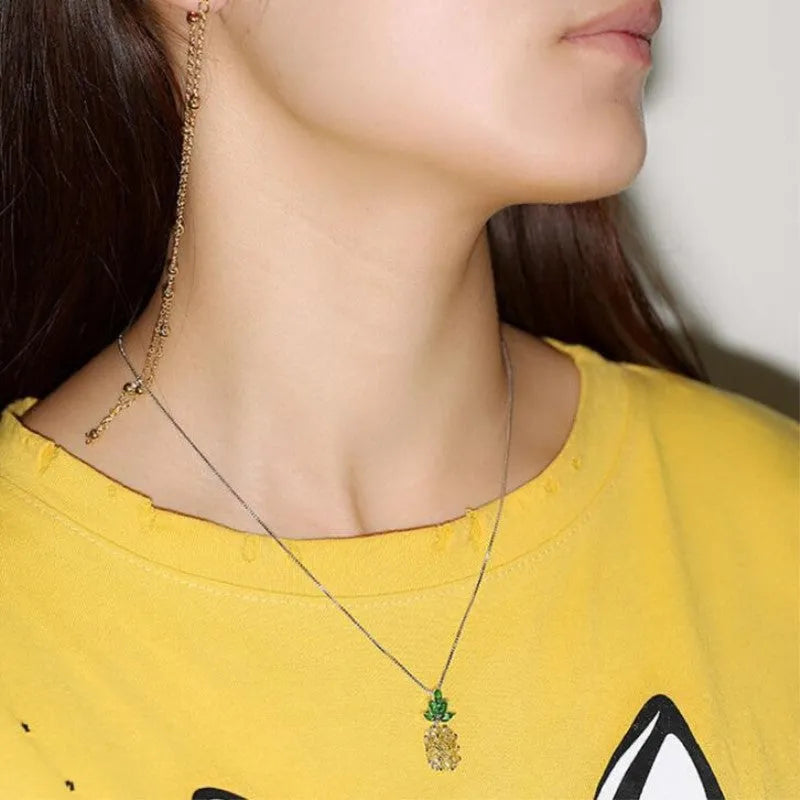 Silver Korean fashion necklace with a geometric pineapple and diamond design pendant.