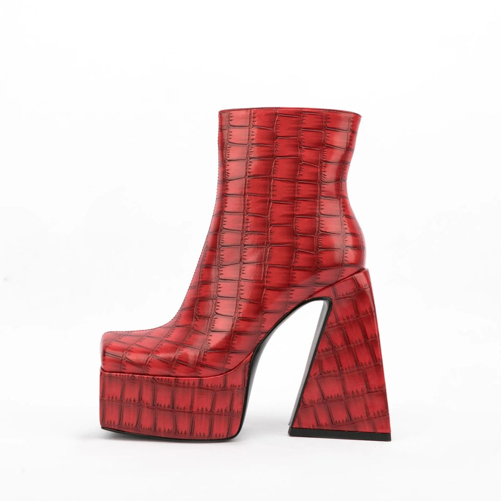 A pair of women's super high heel ankle boots in a solid colour with an artificial PU upper.