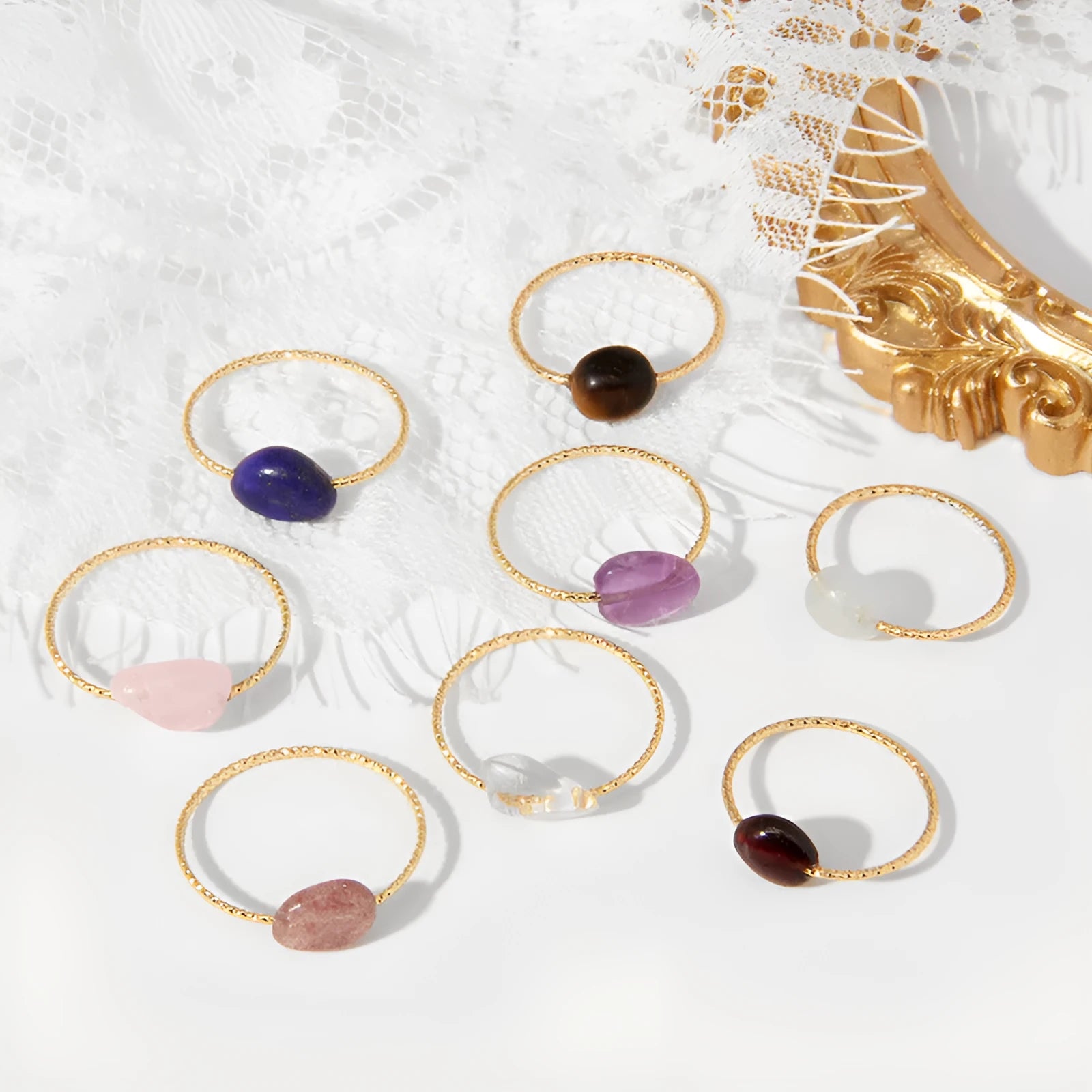 Women's geometric niche design ring with a coloured agate stone centrepiece.