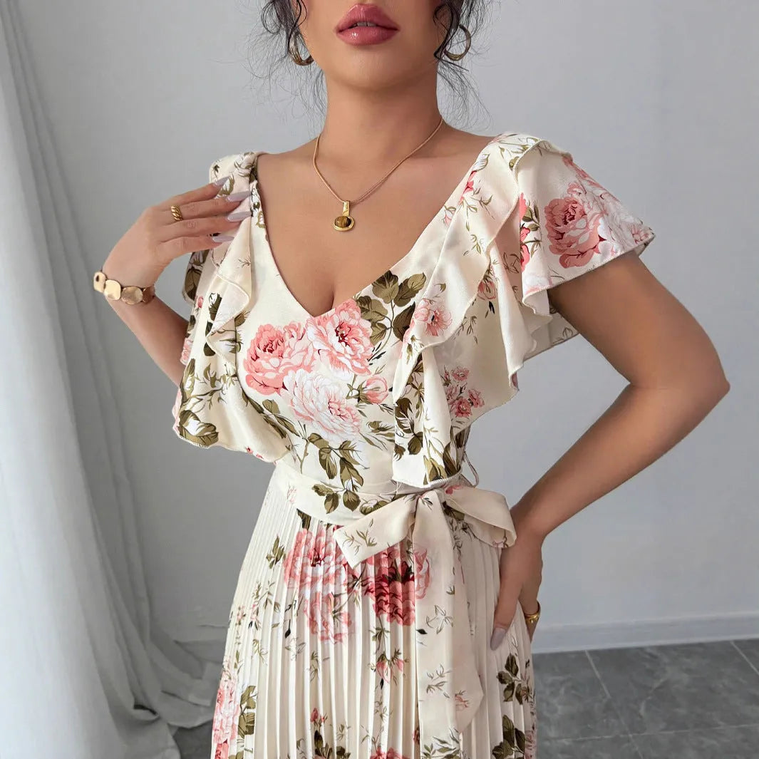 Apricot coloured V-neck floral print dress with ruffled sleeves and an oversized swing skirt