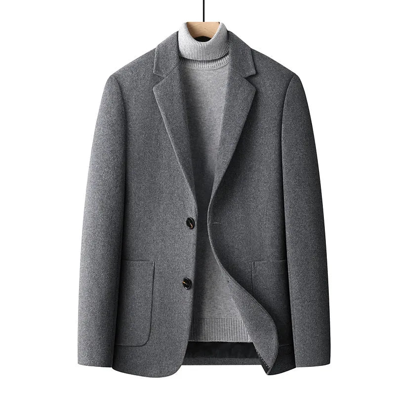 Men's slim-fit wool suit jacket in grey on a hanger.