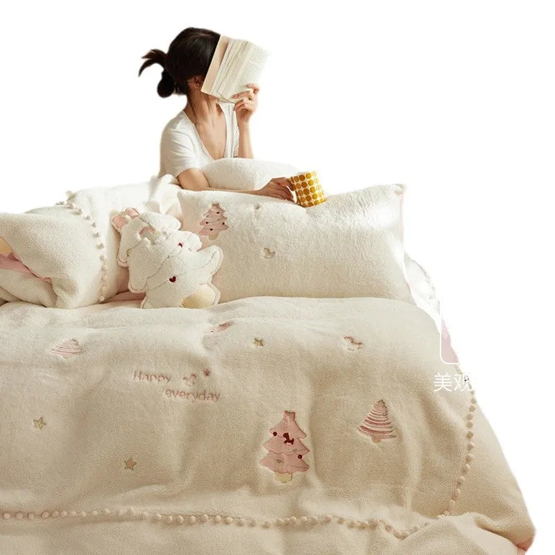 Milk fibre four-piece bedding set with green and pink Christmas tree designs on quilt cover and pillowcases.