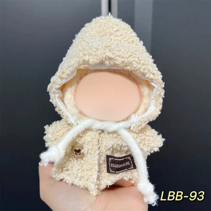 Plastic doll clothes for a 17cm tall vinyl figure on a white background.