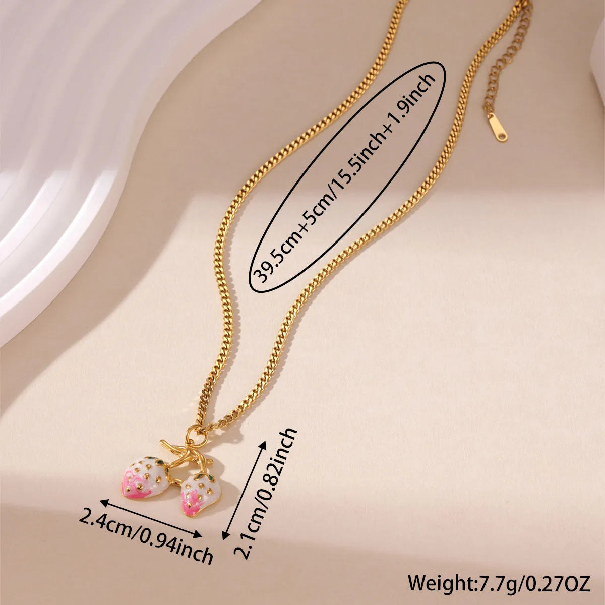 A women's necklace with a detailed strawberry-shaped alloy pendant on a stainless steel chain, shown in red and white gradient colour options.
