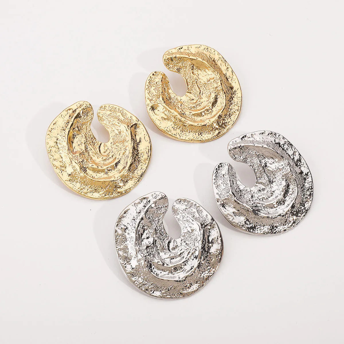 Exaggerated geometric women's earrings with irregular pleats and textured concave-convex surface