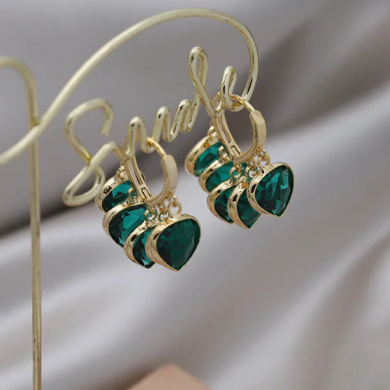 Green heart-shaped Korean style clip earrings with dancing pendant and artificial gemstones