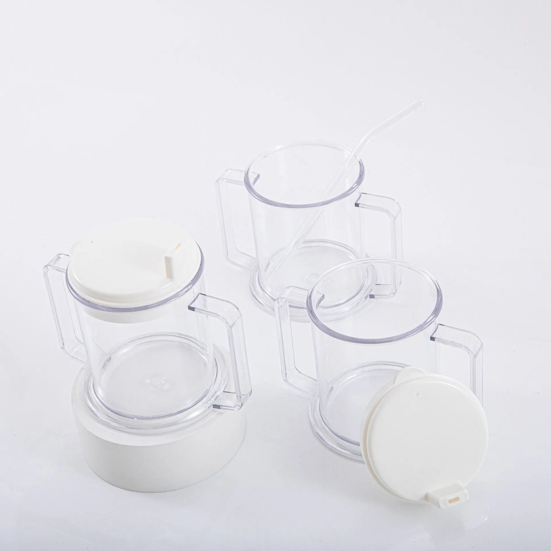 Transparent spill-proof lightweight plastic drinking cup on a table.